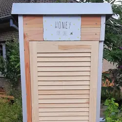 Beekeeper with Honeycomb