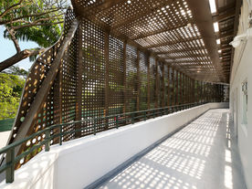 Modern building facade with decorative perforated metal panels