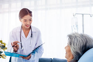 young-asian-female-doctors-visit-senior-woman-patient-bed-explaining-symptoms-examination-