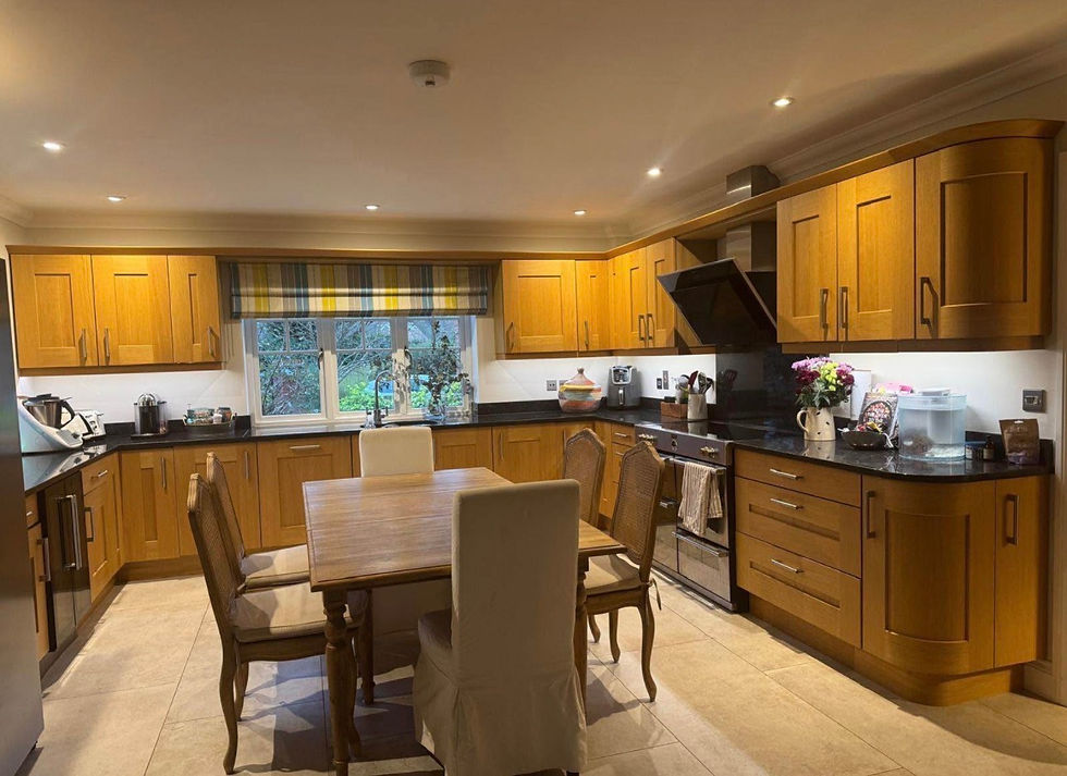 The kitchen we bought in its previous home - I sanded, painted, and varnished the units.