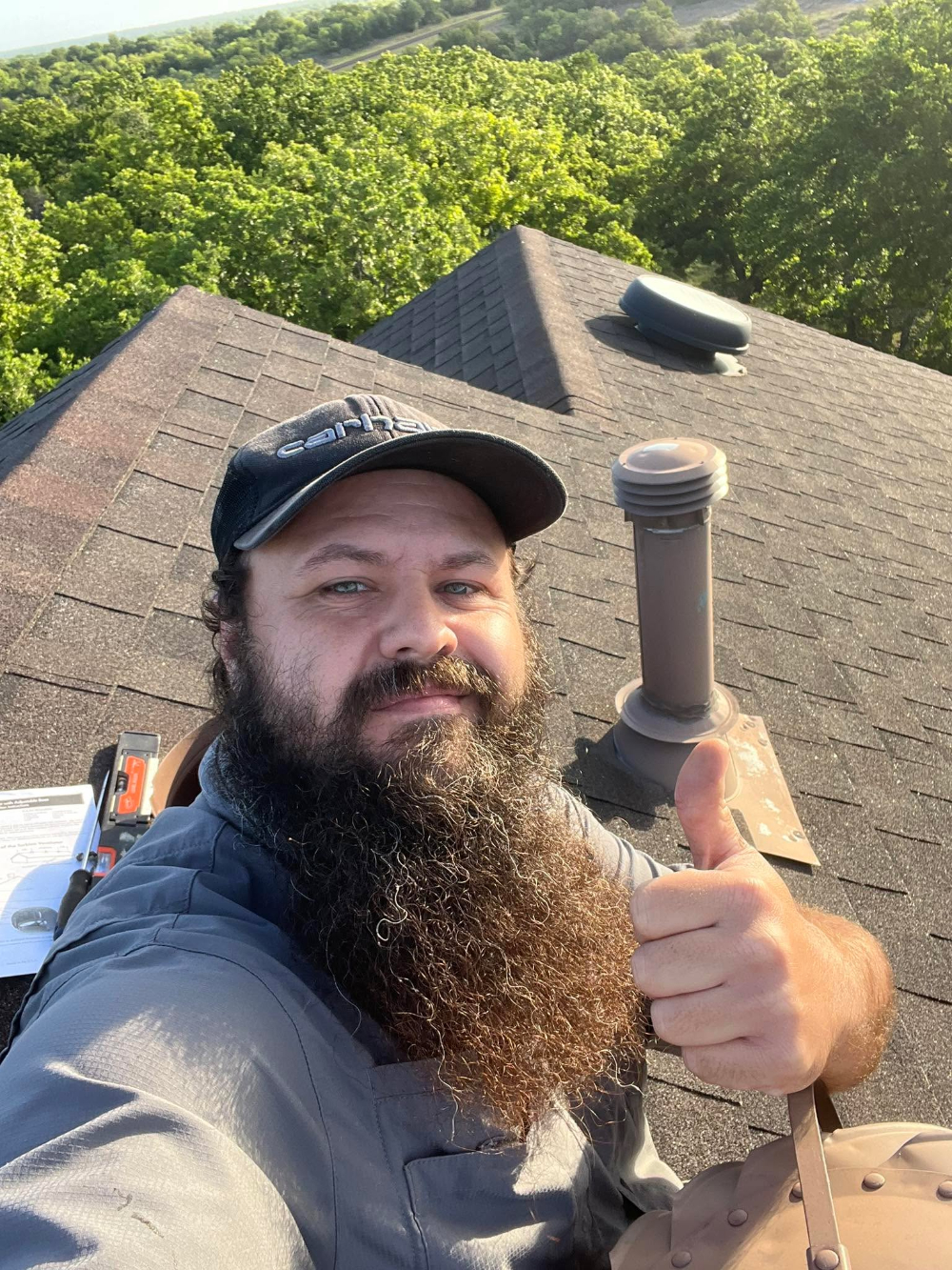 A reliable contractor after completing a roofing job
