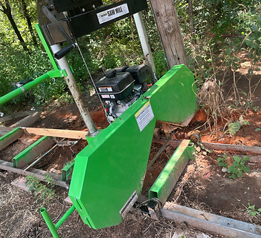 Green portable sawmill outdoors