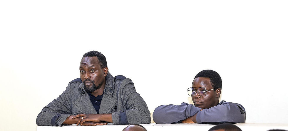 NUP Spokesperson Alex Waiswa Mufumbiro and Mobiliser Sauda Madada in the dock during their hearing.