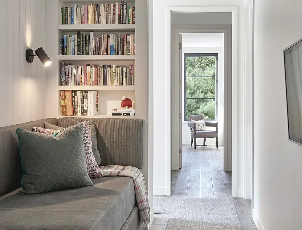 Pure Michigaas by Jaffe Architecture featuring a built-in daybed and reading nook with integrated bookshelves, designed for lounging or accommodating extra guests— a thoughtful detail that adds flexibility for owners in this Harbor Country, Southwest Michigan retreat