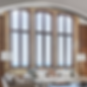 Great room seating area in Shuffling the Decks, a Chicago vintage penthouse gut renovation by Jaffe Architecture, where restored arched windows frame views to Lake Michigan and shape the space