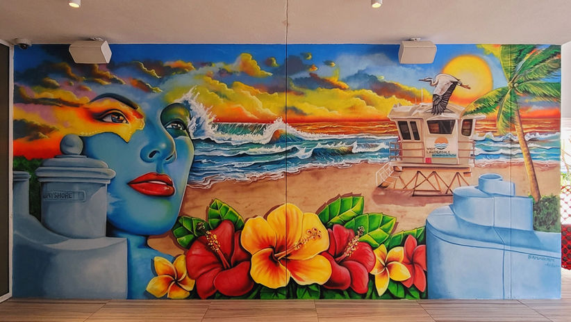 Wall mural of woman's face and Fort Lauderdale beach sunset painted at W Hotel