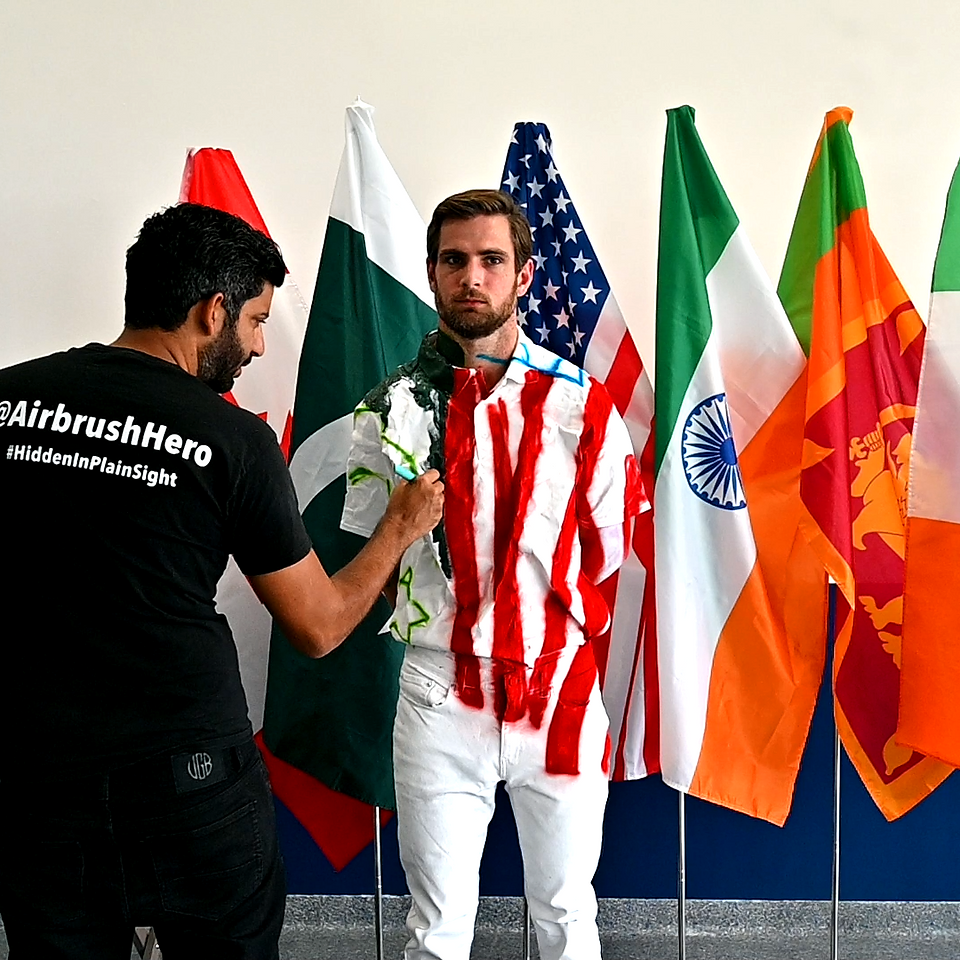 Camouflage body painting into flags 