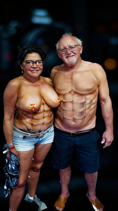 Couple both with airbrush painted six-pack abs body paint at Fantasy Fest Key West, smiling for the camera
