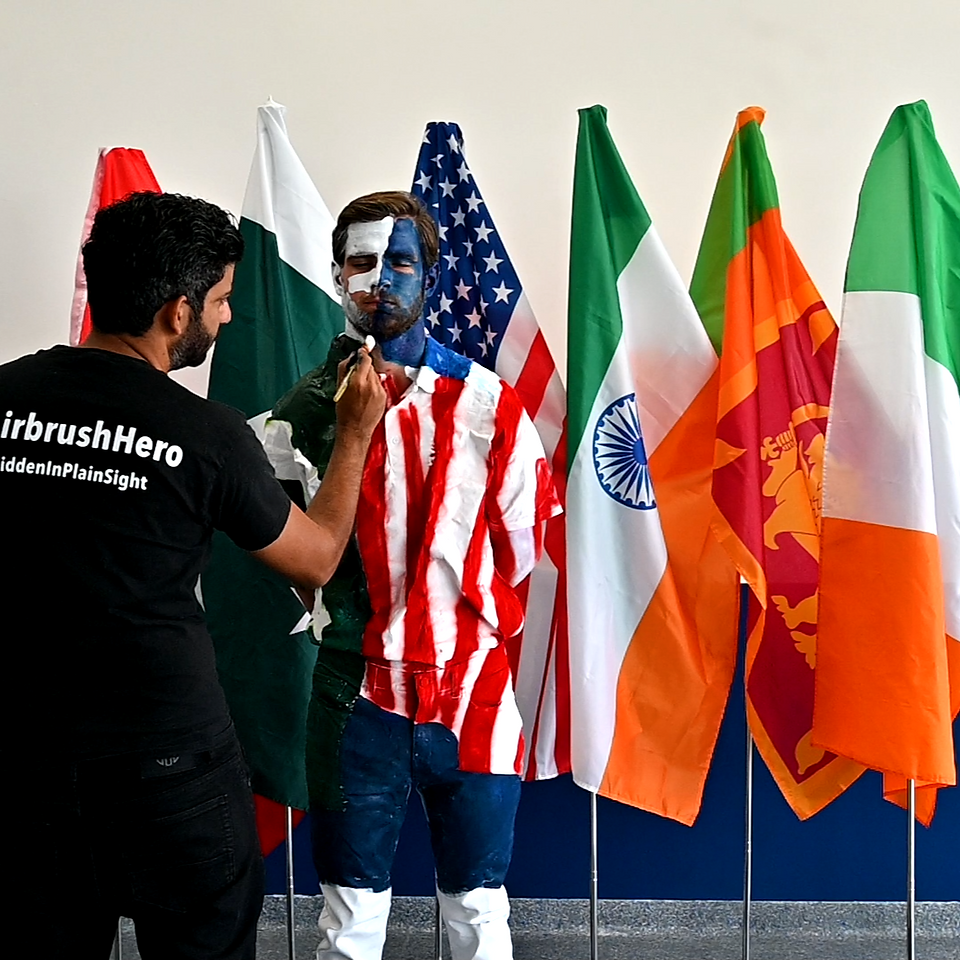 Camouflage body painting into flags 