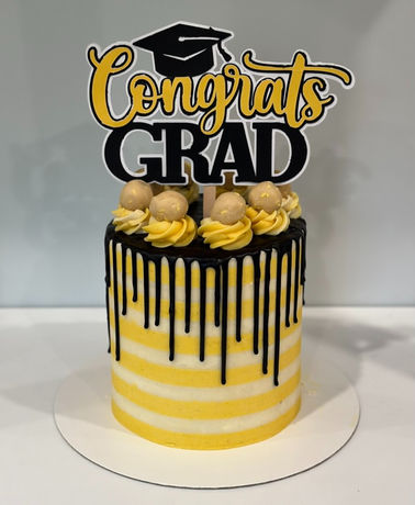 gluten free yellow striped cake with a chocolate drip for a vcu graduate