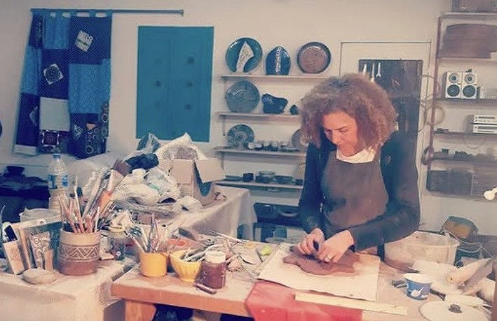 Heba Helmi working in her studio in the historic pottery area of Fustat in Cairo, Egypt.
