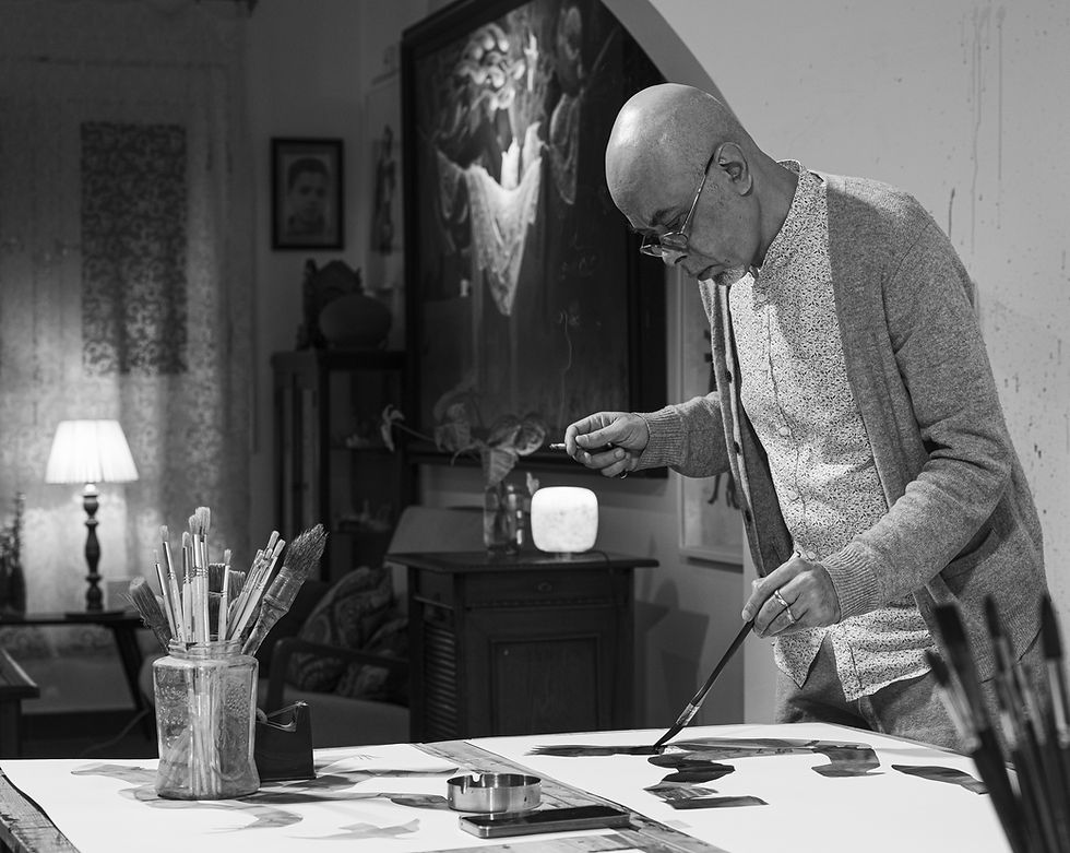 Nazir Tanbouli creating an ink drawing in his Garden City, Cairo studio