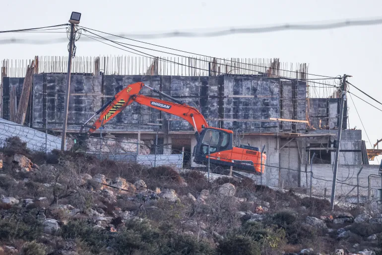 An Israeli bulldozer works near the Israeli settlement of Migdalim, close to the Palestinian village of Qusra, south of the city of Nablus in the Israeli-occupied West Bank, on September 6, 2026. [Jaafar Ashtiyeh/AFP]