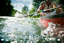Kayaker paddling in clear waters