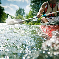 Kayaker paddling in clear waters