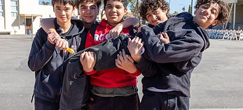 sports-fans-in-a-huddle-at-a-tailgate-event-2023-11-27-04-57-54-utc.png
