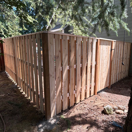Good neighbor cedar fence with a top cap and gate in Oregon City, OR