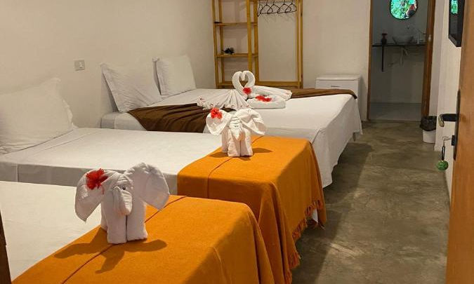 Quarto com cama na POUSADA TAIEIRAS