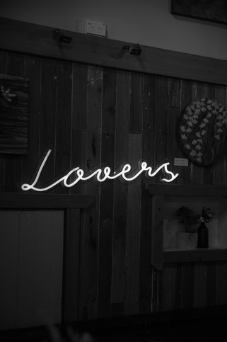 Neon sign saying 'lovers'