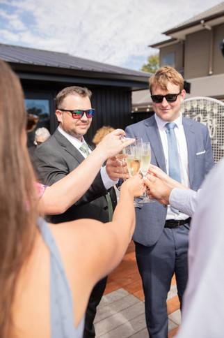 Wedding guests cheers their drinks togther