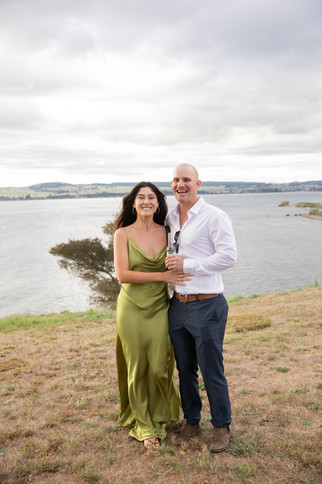 Wedding guests at golden hour by Lake Taupo