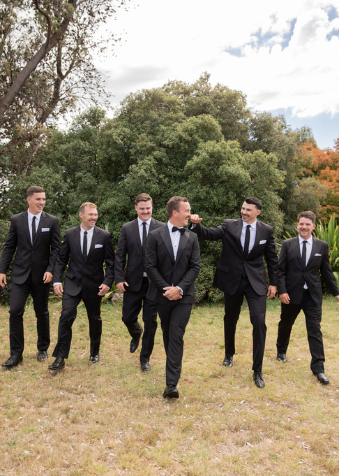 Groomsmen candidly walking together