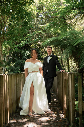 Editorial style image of the bride and groom at the Wainui Bush Park, in Raglan