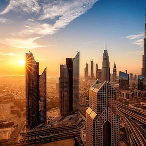 Panoramic view of Dubai's skyline featuring a mix of modern skyscrapers and residential developments, illustrating the city's dynamic real estate landscape amid anticipated market corrections.