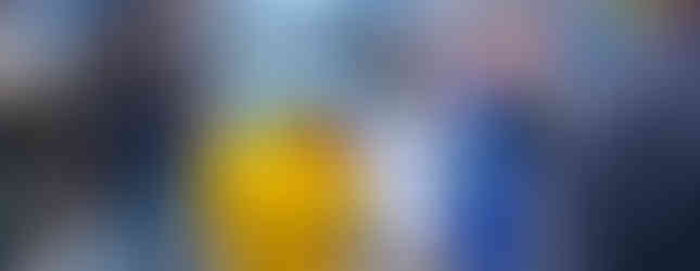 blue elephant character greeting a child