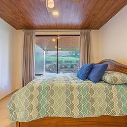 Guest bedroom with view to terrace Costa Rica farm house