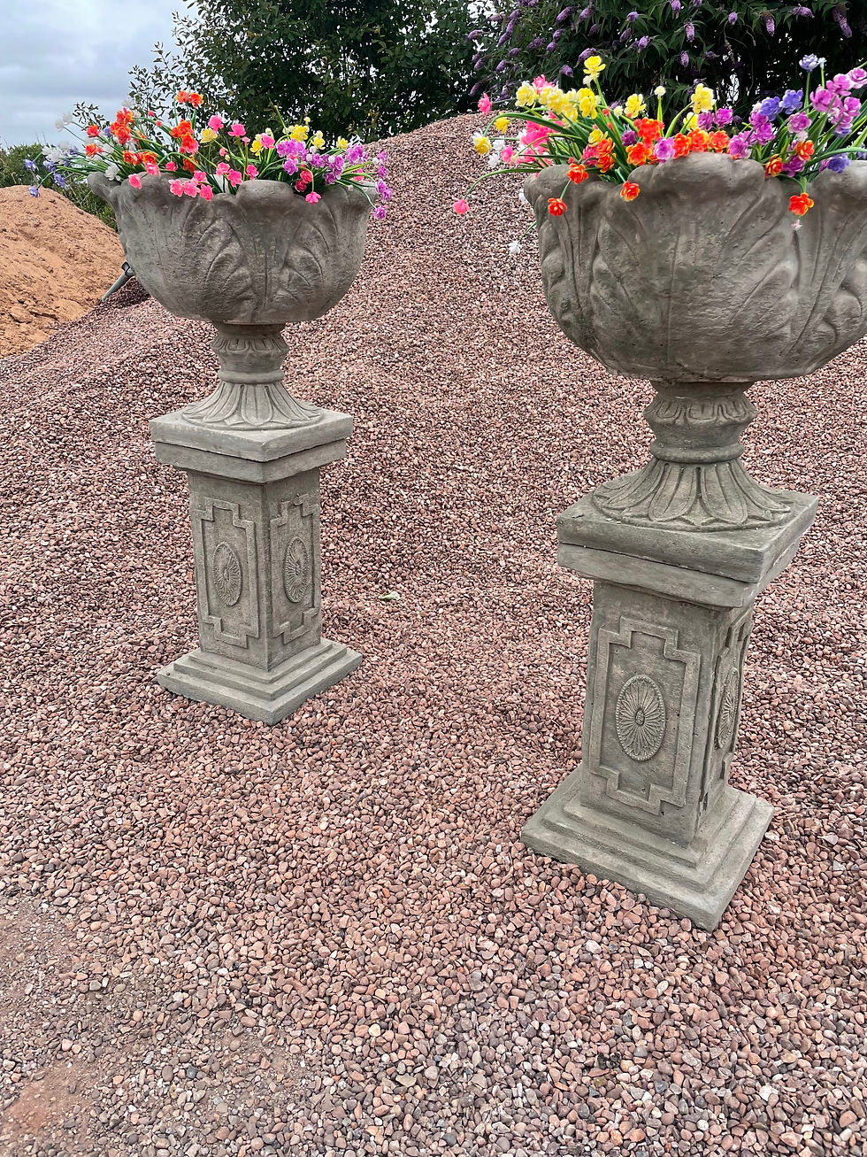 Thumbnail: Aged pair of plinths and tulip planters