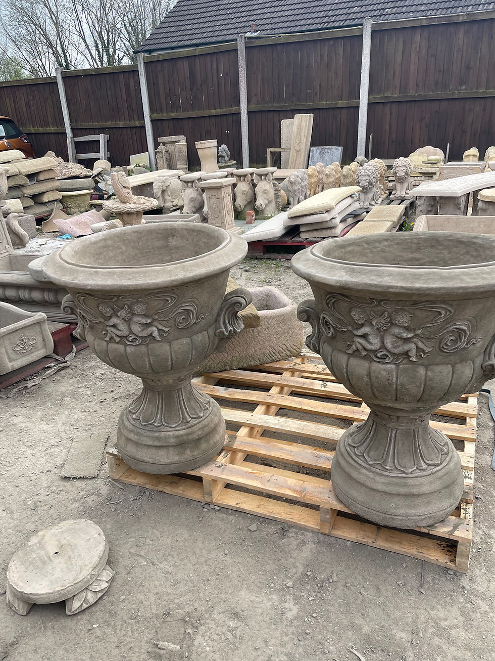 Thumbnail: Pair of cherub vases in a aged finish 
