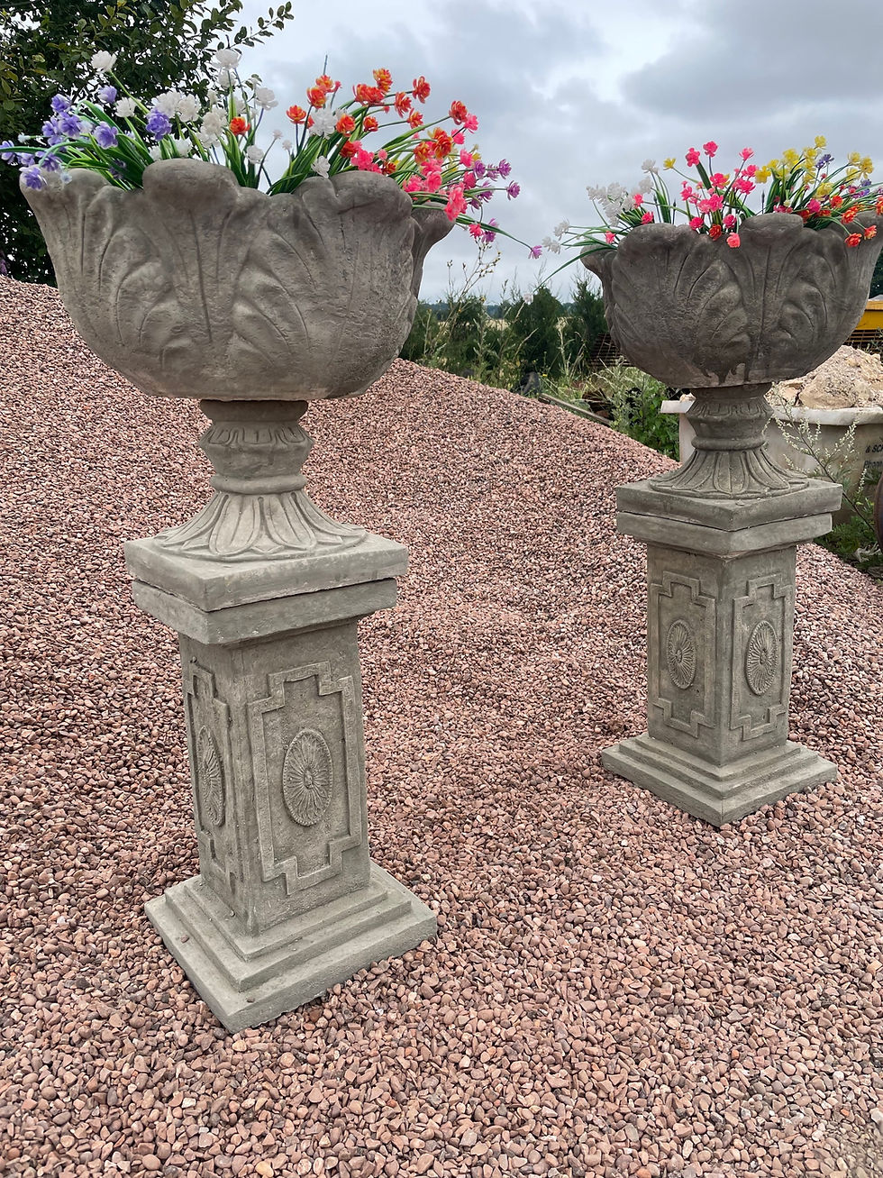 Thumbnail: Aged pair of plinths and tulip planters