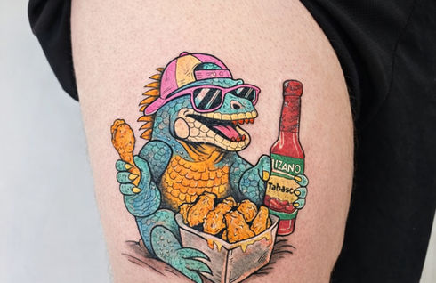 Color iguana tattoo with sunglasses and tropical details created at White Sloth Tattoo Studio in Tamarindo, Costa Rica.