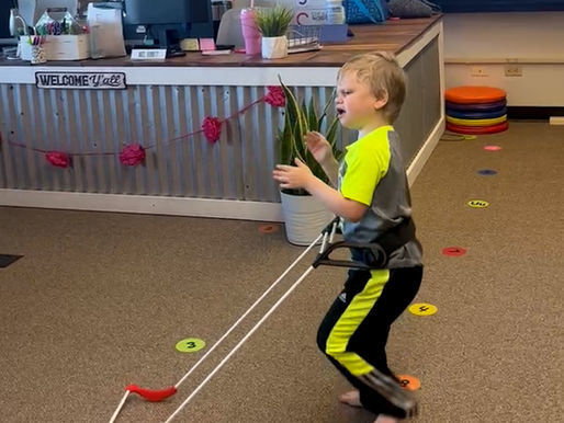 4-year-old boy walks through his classroom wearing a belt cane