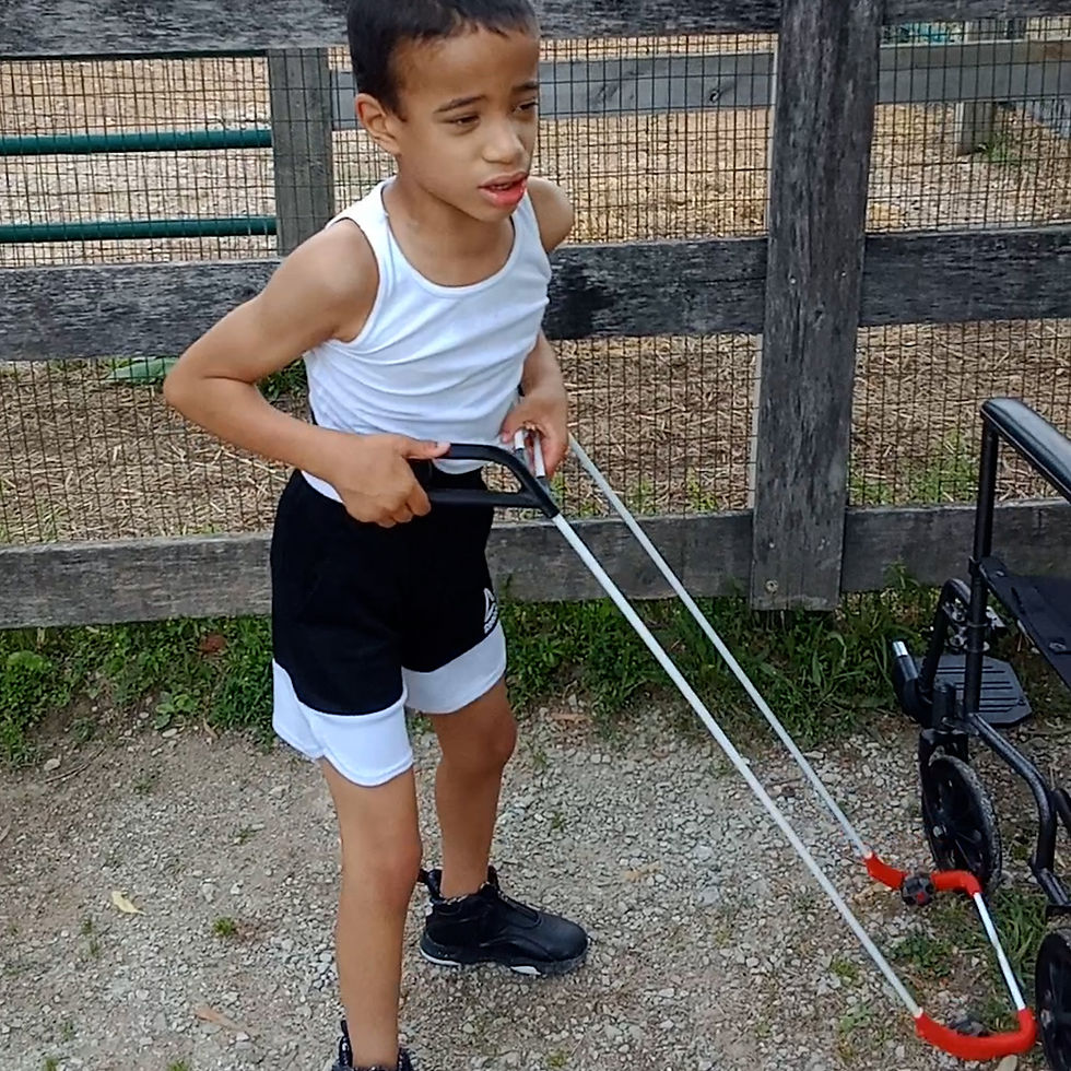 Close-up of a child's Belt Cane touching the edge of an obstacle in the path
