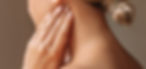 Inflamed tonsillar lymph nodes. Young woman touches enlarged lymph nodes under jaw on her