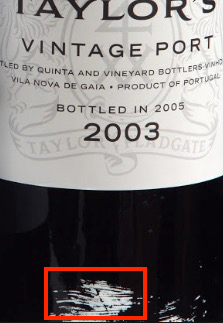Splash of white paint on Taylor Vintage Port - the white paint should be facing up when cellared for best results