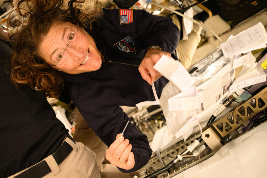 NASA astronaut Christina Koch with a pipette and saliva booklet for the Immune Biomarkers study, 8 April 2026. The samples support research on immune and other health indicators. Credit: NASA. Image record.
