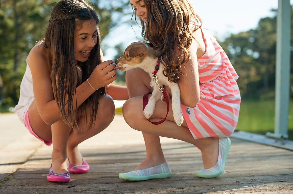 2 kids with dog
