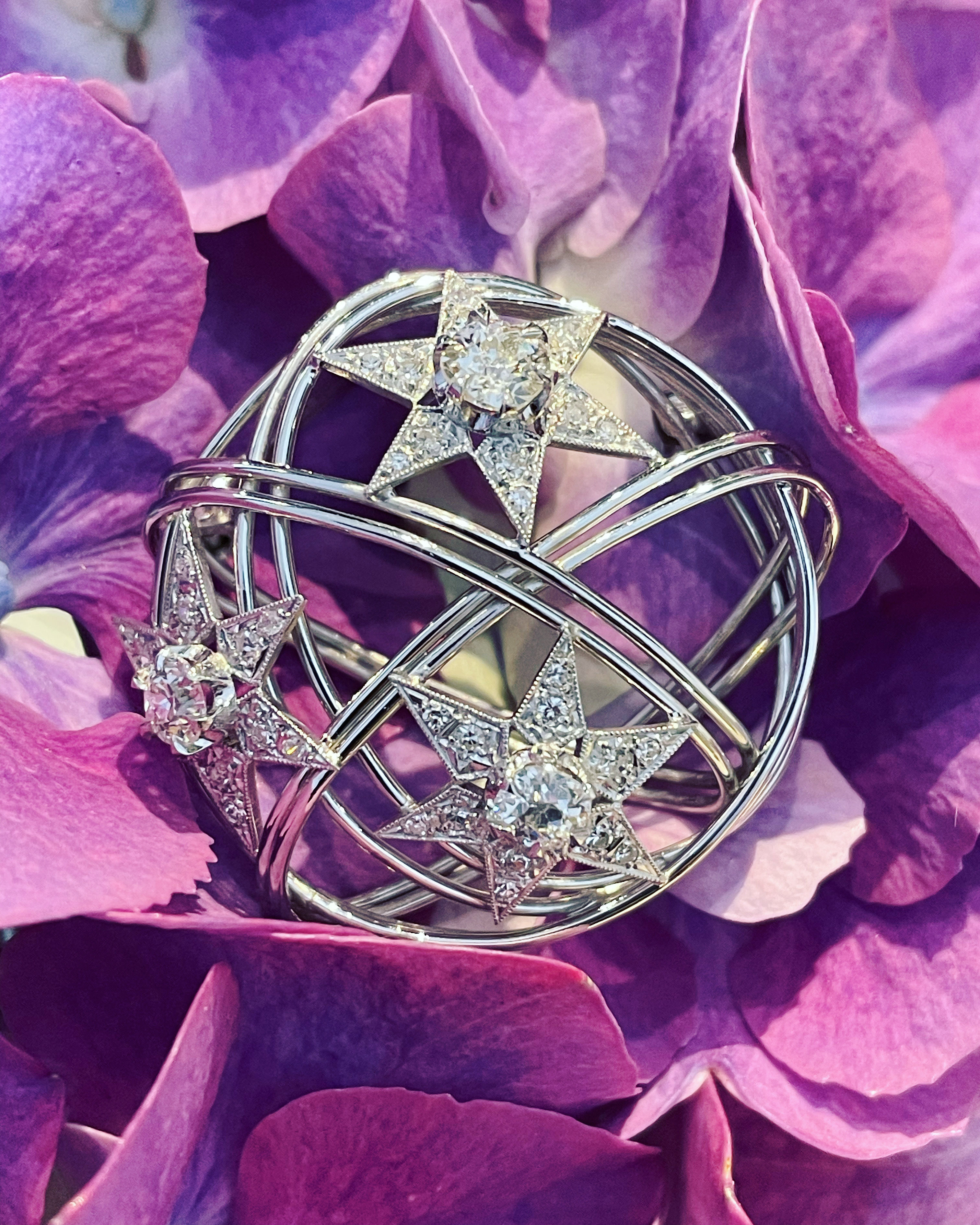 Mid century diamond satellite in orbit brooch