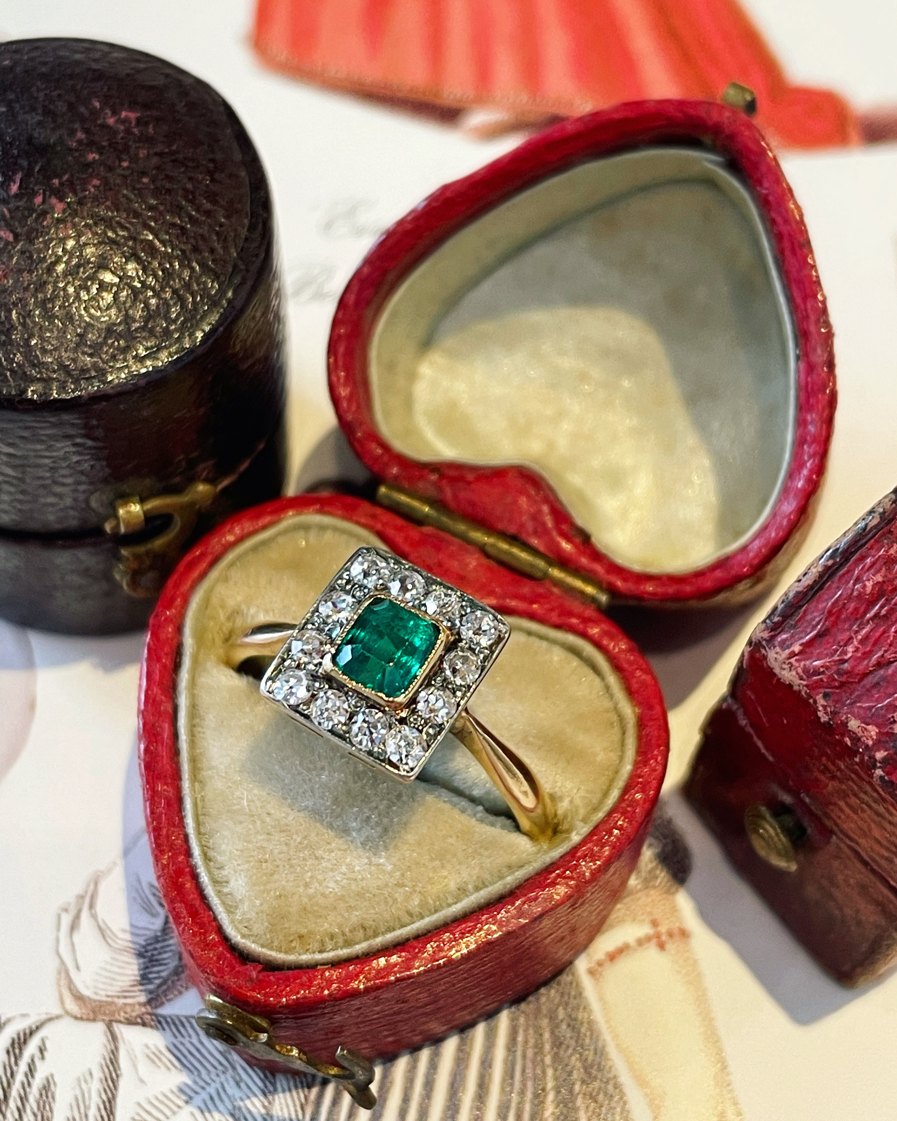 A Pretty Vintage Emerald and Diamond Cluster Ring
