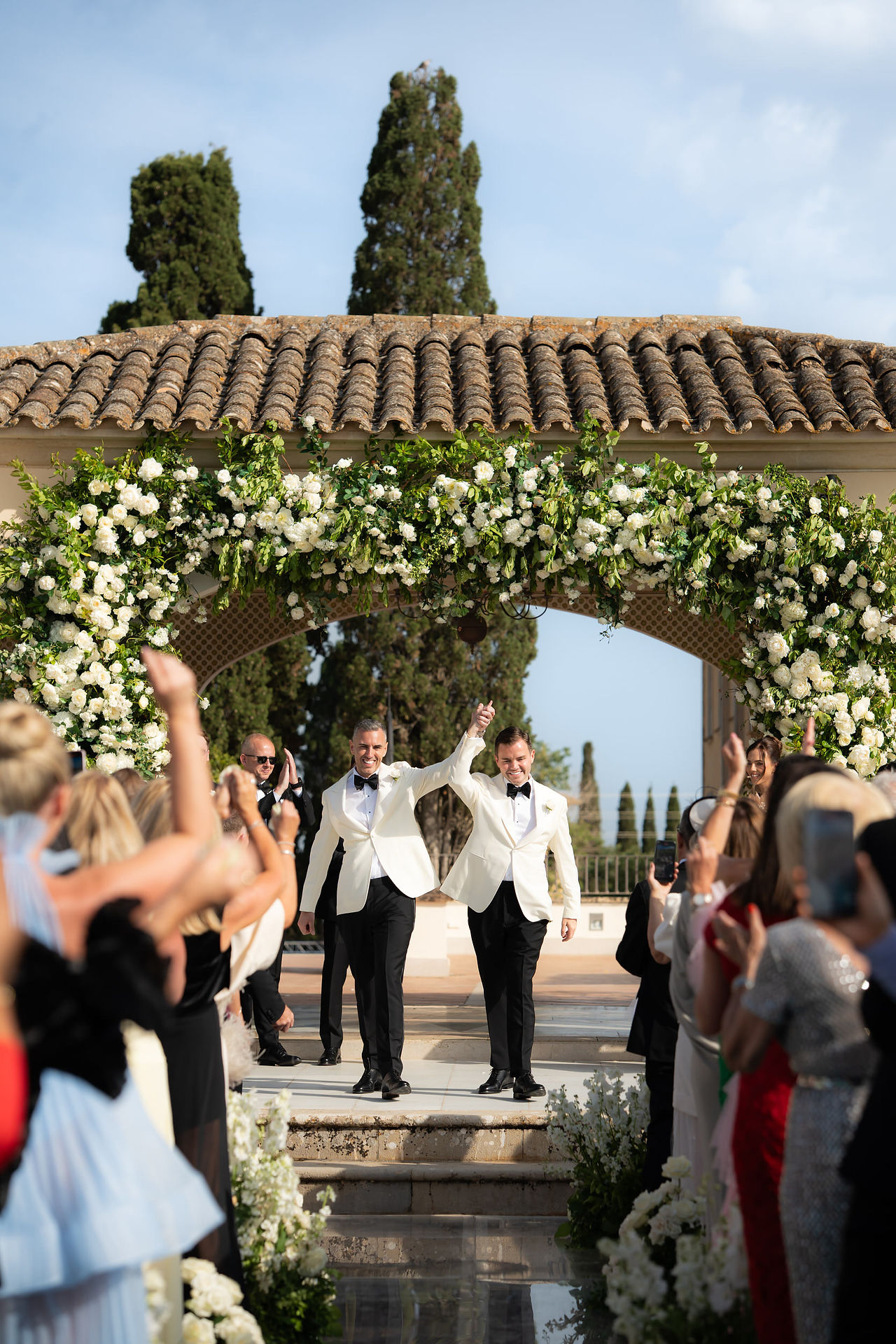 Grooms celebrating their ceremony exit at Son Julia Country House Mallorca
