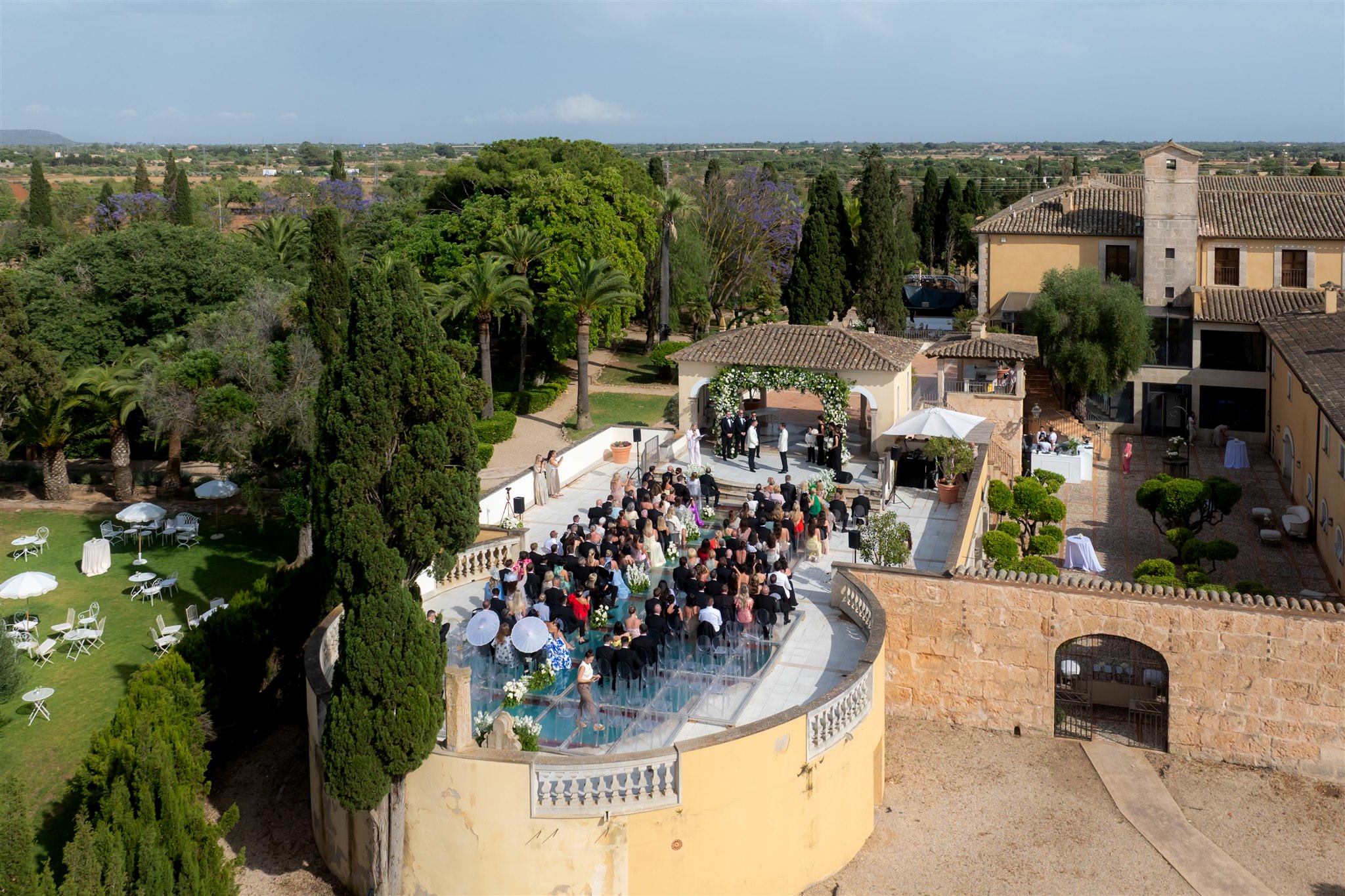 Aerial view of wedding reception with pool and guests at finca venue Son Julia Country House, Mallorca, Spain