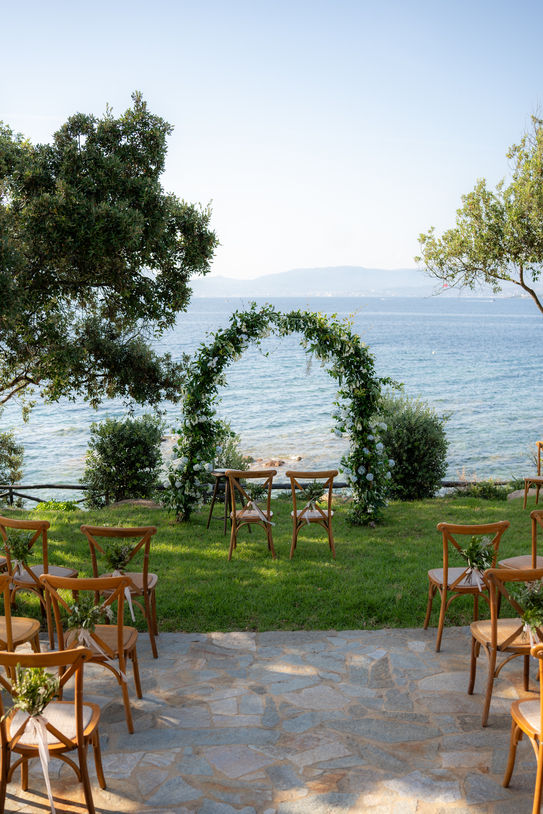 Elegant wedding ceremony setup overlooking the Mediterranean Sea in Corsica.