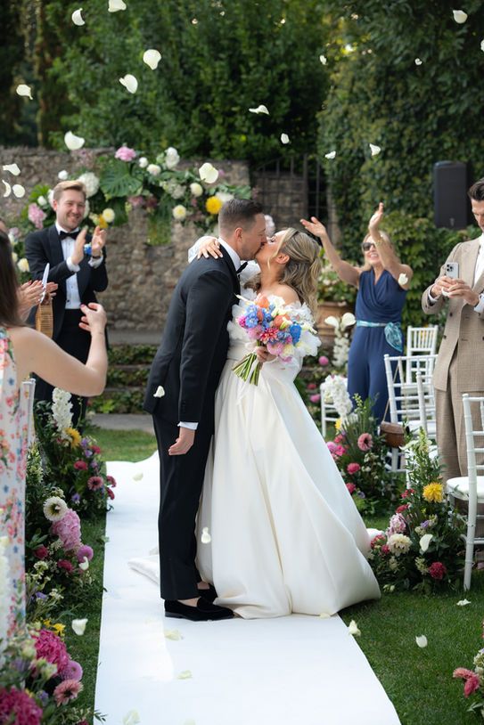 Bride and groom celebrating after their wedding ceremony in Italy