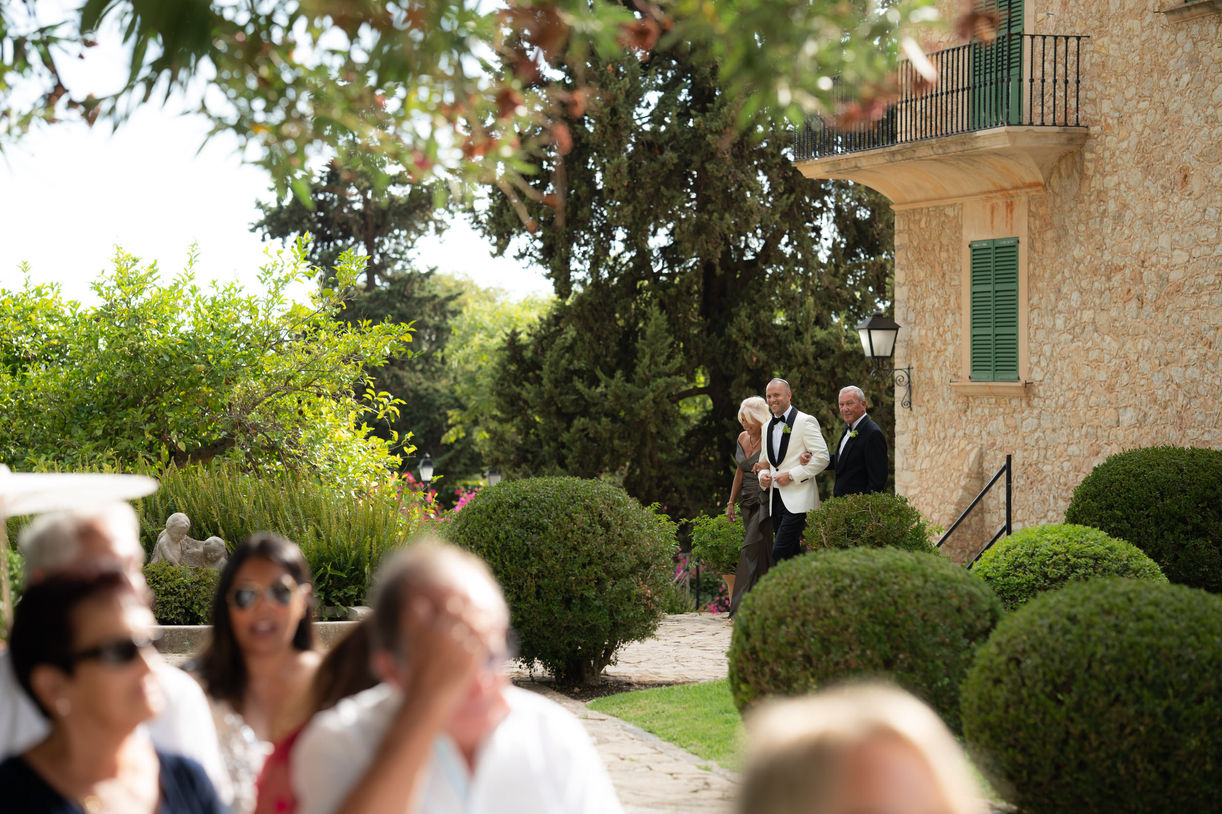 Guests arriving at ceremony during Mallorca finca wedding.