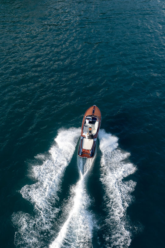 Drone photo of bride and groom on a boat at Lake Garda wedding in Villa Fiordaliso Italy