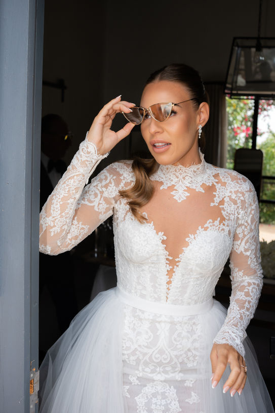 Bride wearing sunglasses during destination wedding preparations in Mallorca
