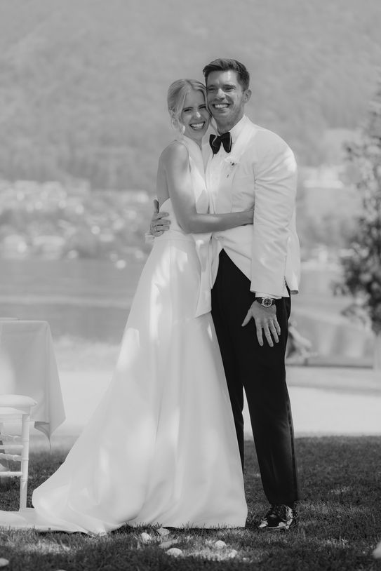 Bride and groom embracing during Tegernsee wedding.